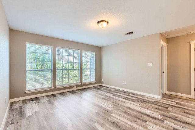2632 Century Park Blvd Unit 3, Austin, TX 78727 - empty room with visible vents, baseboards, and wood finished floors