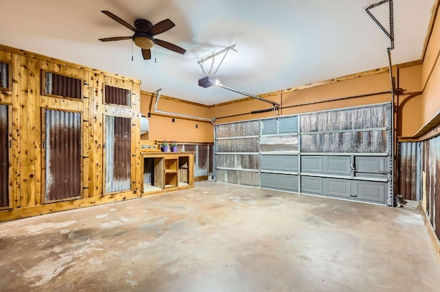 2632 Century Park Blvd Unit 3, Austin, TX 78727 - garage with wood walls, a garage door opener, and a ceiling fan