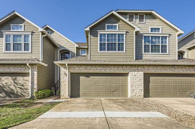 2632 Century Park Blvd Unit 3, Austin, TX 78727 - view of front of home with a shingled roof, a garage, and concrete driveway