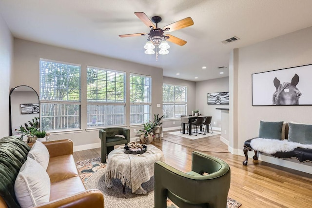 2632 Century Park Blvd Unit 3, Austin, TX 78727 - living area featuring visible vents, ceiling fan, wood finished floors, and baseboards