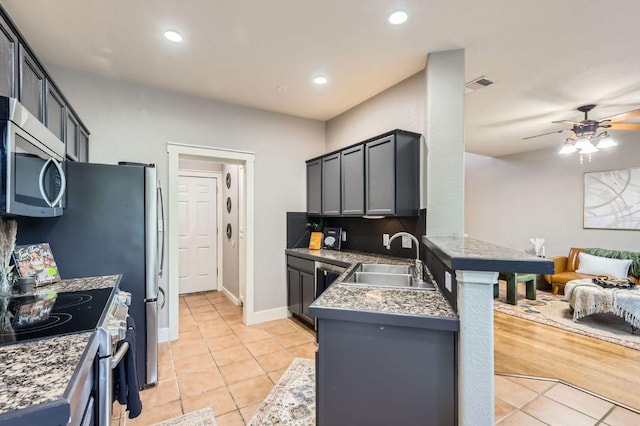 2632 Century Park Blvd Unit 3, Austin, TX 78727 - kitchen with ceiling fan, light tile patterned floors, visible vents, appliances with stainless steel finishes, and a sink