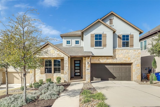 508 Saturnia Cv, Georgetown, TX 78628 - view of front of house featuring stone siding, an attached garage, stucco siding, and driveway