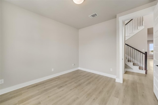 508 Saturnia Cv, Georgetown, TX 78628 - unfurnished room featuring stairway, light wood-style flooring, and baseboards