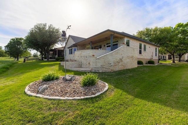108 Chuckwagon Trl, Georgetown, TX 78633 - view of property exterior featuring stone siding and a yard