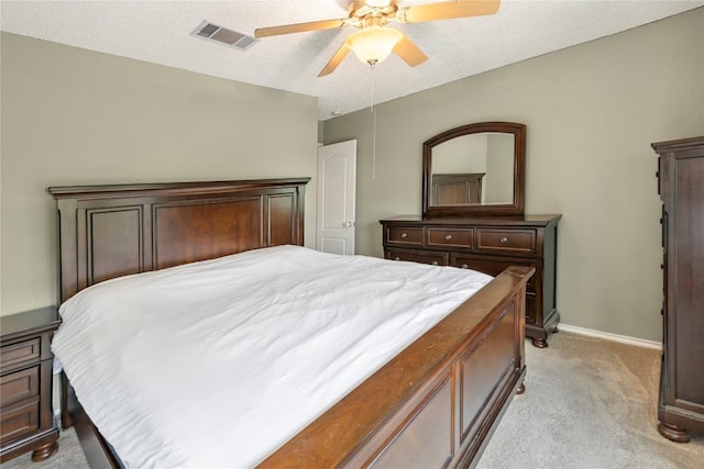 bedroom with light colored carpet, baseboards, and a ceiling fan