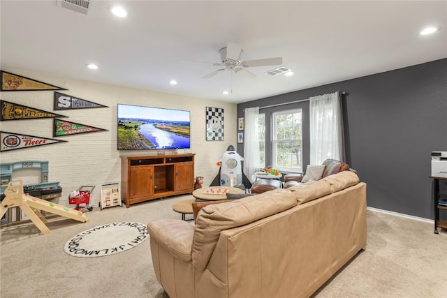 living area with light colored carpet, a ceiling fan, recessed lighting, and baseboards