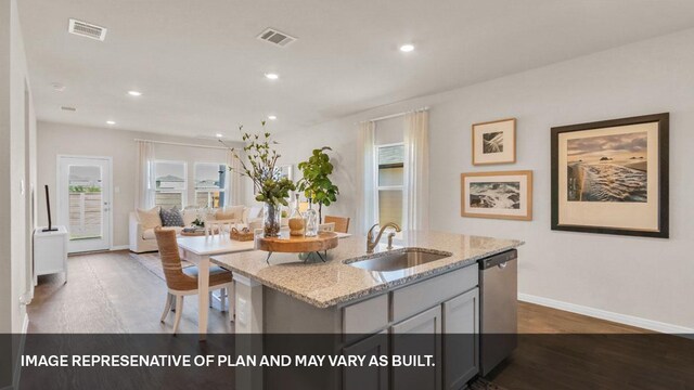 395 Morning Glory Loop, Kyle, TX 78640 - kitchen with dishwasher, a sink, wood finished floors, baseboards, and recessed lighting