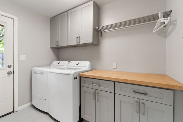 5911 W Gate Blvd, Austin, TX 78745 - washroom featuring cabinet space, separate washer and dryer, baseboards, and light tile patterned floors