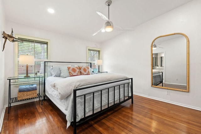 5911 W Gate Blvd, Austin, TX 78745 - bedroom featuring wood finished floors, multiple windows, and baseboards