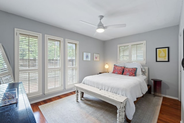 5911 W Gate Blvd, Austin, TX 78745 - bedroom with wood finished floors, ceiling fan, and baseboards