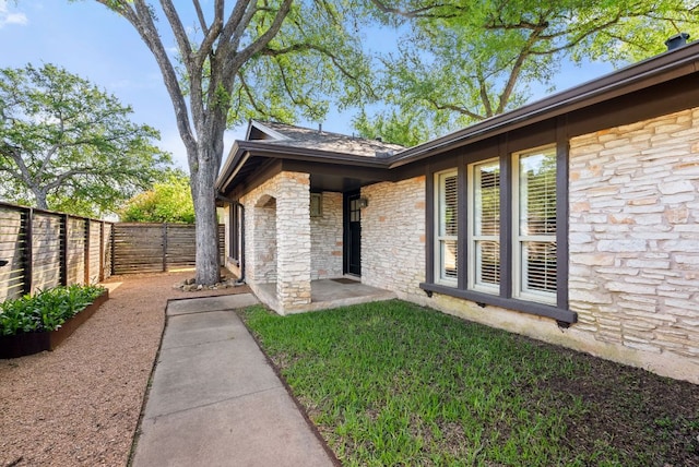 5911 W Gate Blvd, Austin, TX 78745 - property entrance with stone siding
