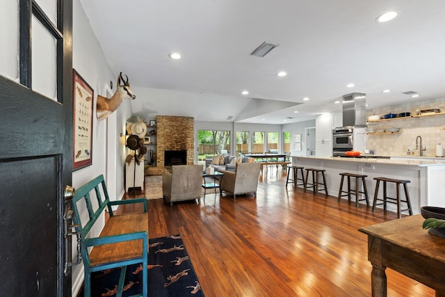 5911 W Gate Blvd, Austin, TX 78745 - living area with a fireplace, recessed lighting, and dark wood finished floors
