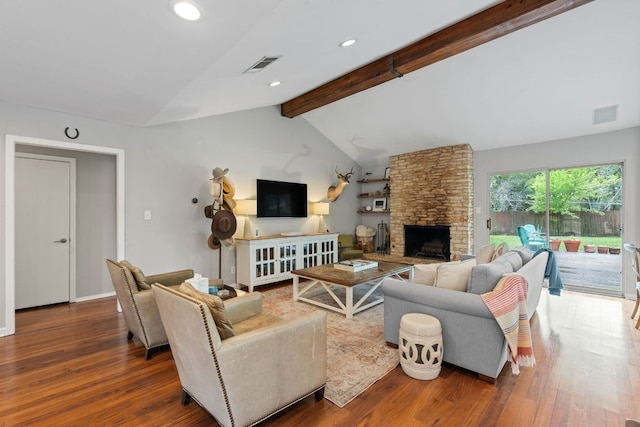 5911 W Gate Blvd, Austin, TX 78745 - living room with wood finished floors, a stone fireplace, and recessed lighting