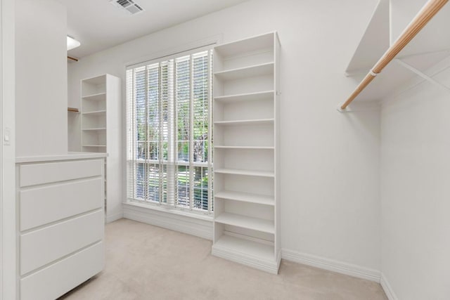 walk in closet featuring carpet and visible vents