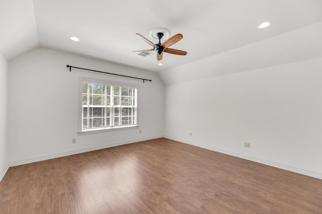 spare room featuring visible vents, a ceiling fan, recessed lighting, wood finished floors, and lofted ceiling