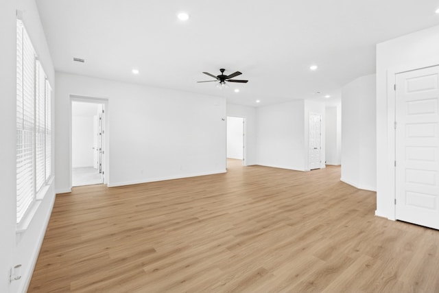 220 Washington Dr, Kyle, TX 78640 - unfurnished living room featuring ceiling fan, light wood finished floors, recessed lighting, and baseboards