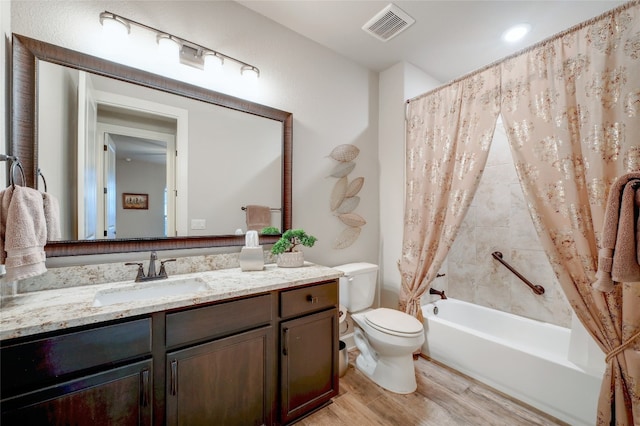 262 Singing Sumac Way, San Marcos, TX 78666 - full bath featuring vanity, shower / bath combo with shower curtain, and wood finished floors