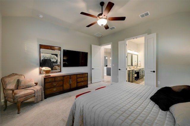 262 Singing Sumac Way, San Marcos, TX 78666 - bedroom with light colored carpet, vaulted ceiling, ceiling fan, and ensuite bathroom