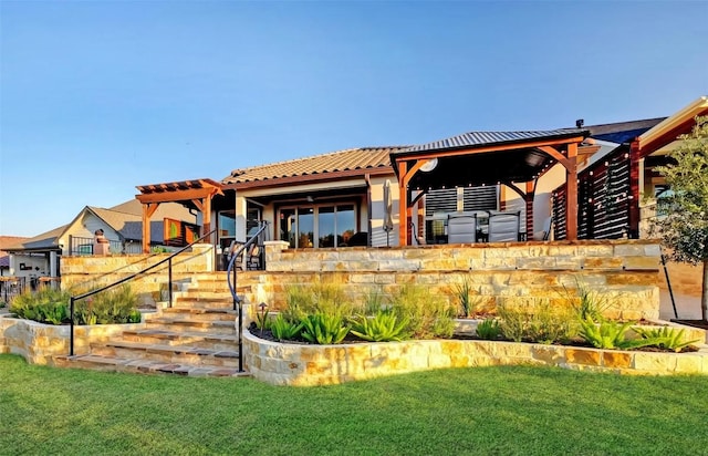262 Singing Sumac Way, San Marcos, TX 78666 - back of property featuring a lawn and a tiled roof