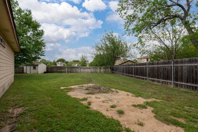 141 Sydneys Way, Buda, TX 78610 - fenced backyard featuring a shed