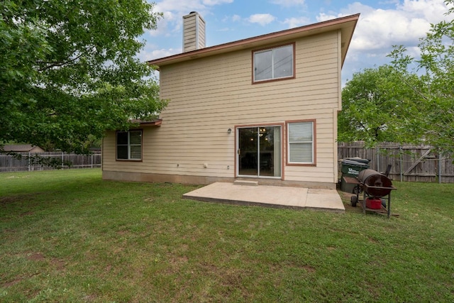 141 Sydneys Way, Buda, TX 78610 - back of property with a patio, a fenced backyard, and a chimney
