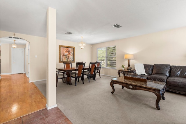 141 Sydneys Way, Buda, TX 78610 - living room featuring arched walkways and a chandelier