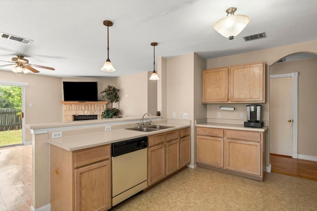 141 Sydneys Way, Buda, TX 78610 - kitchen featuring dishwasher, a peninsula, light countertops, a ceiling fan, and arched walkways