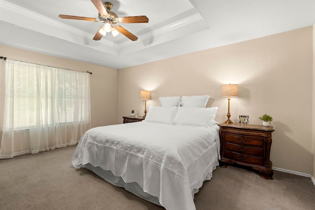 141 Sydneys Way, Buda, TX 78610 - carpeted bedroom featuring a tray ceiling, crown molding, and ceiling fan