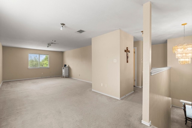 141 Sydneys Way, Buda, TX 78610 - carpeted empty room featuring a chandelier and baseboards