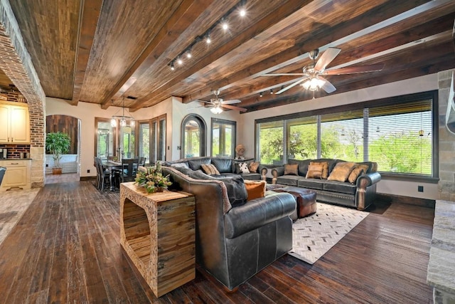 living room featuring baseboards, ceiling fan, wood ceiling, dark wood-style floors, and beam ceiling