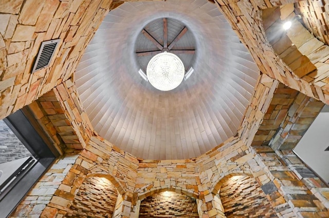 details featuring an inviting chandelier and visible vents