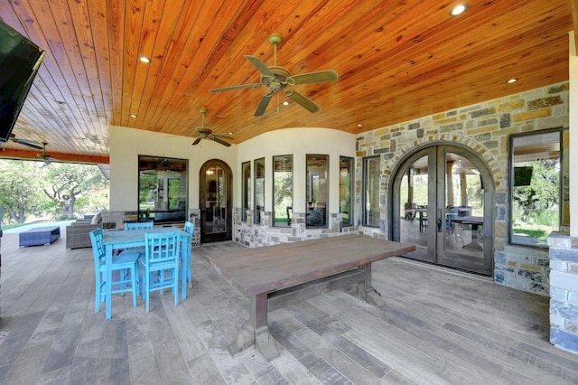 view of patio with a ceiling fan, french doors, and outdoor dining area
