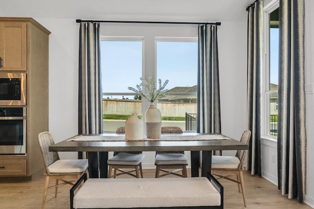 400 Veneta Ln, Georgetown, TX 78633 - dining space featuring light wood-style floors and healthy amount of natural light