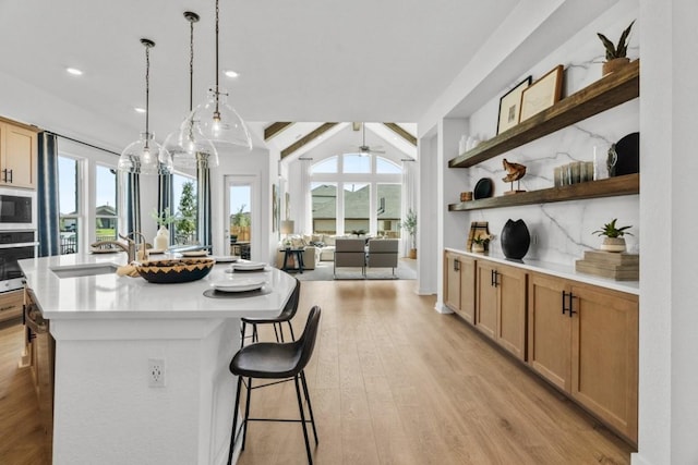 400 Veneta Ln, Georgetown, TX 78633 - kitchen with oven, plenty of natural light, open shelves, light countertops, and recessed lighting