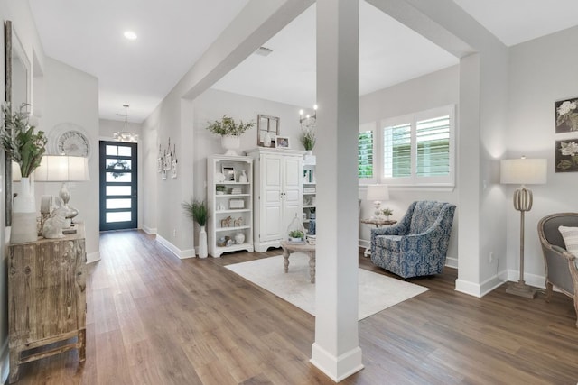 121 Monterey Oak Trl, Georgetown, TX 78628 - entrance foyer featuring an inviting chandelier, wood finished floors, and plenty of natural light