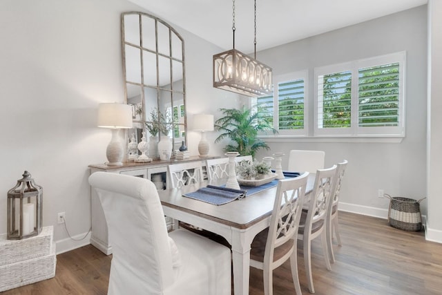 121 Monterey Oak Trl, Georgetown, TX 78628 - dining area featuring wood finished floors, a notable chandelier, and baseboards
