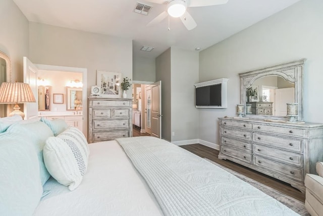 121 Monterey Oak Trl, Georgetown, TX 78628 - bedroom with visible vents, baseboards, ensuite bath, and dark wood finished floors