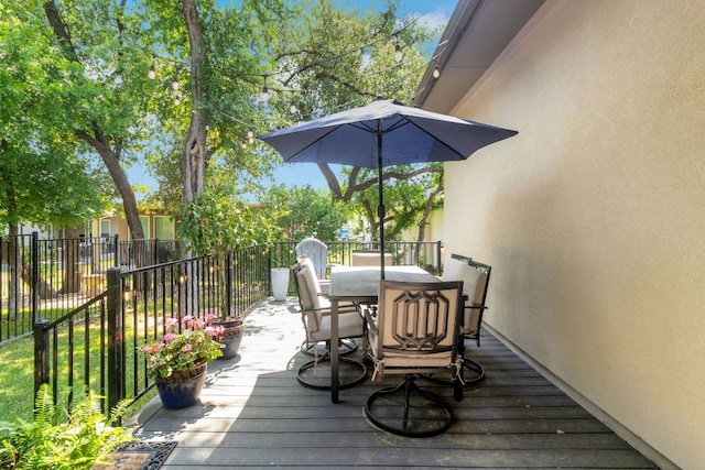 121 Monterey Oak Trl, Georgetown, TX 78628 - wooden terrace featuring outdoor dining space and fence