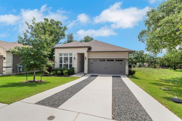 121 Monterey Oak Trl, Georgetown, TX 78628 - single story home with a front yard, concrete driveway, stone siding, and a garage