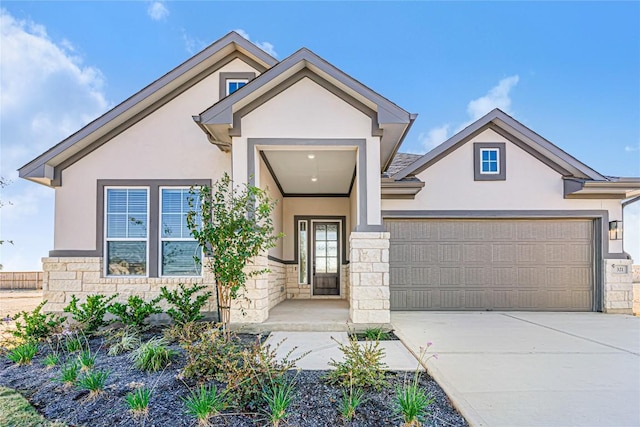 508 Raleigh Dr, Georgetown, TX 78633 - view of front of property with stucco siding, stone siding, concrete driveway, and a garage