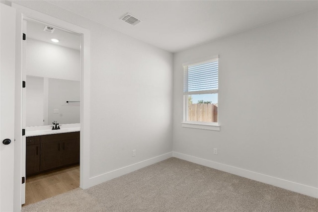 508 Raleigh Dr, Georgetown, TX 78633 - unfurnished bedroom with light carpet and connected bathroom