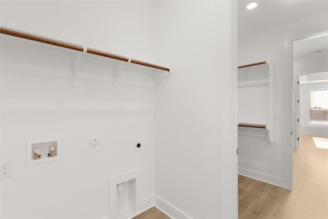 508 Raleigh Dr, Georgetown, TX 78633 - laundry area featuring hookup for a washing machine, hookup for an electric dryer, light wood-type flooring, hookup for a gas dryer, and recessed lighting