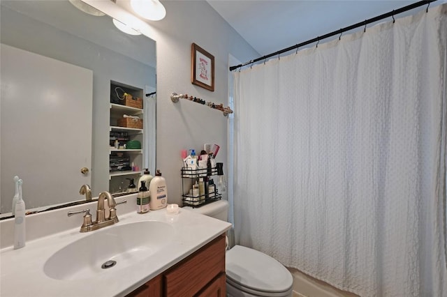 full bathroom with toilet, vanity, and a shower with shower curtain