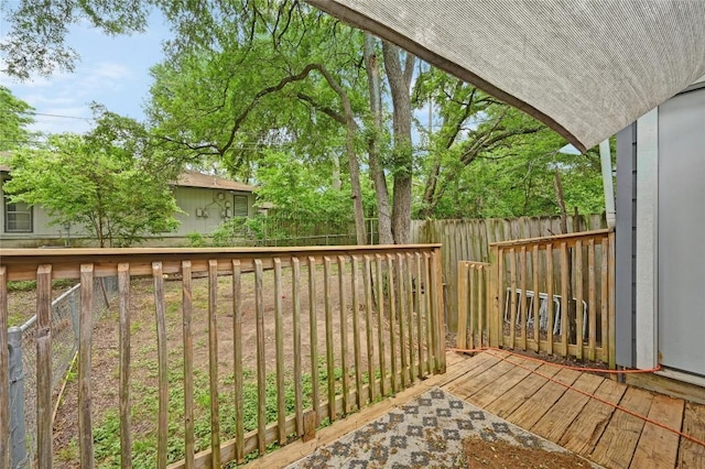 wooden deck featuring fence