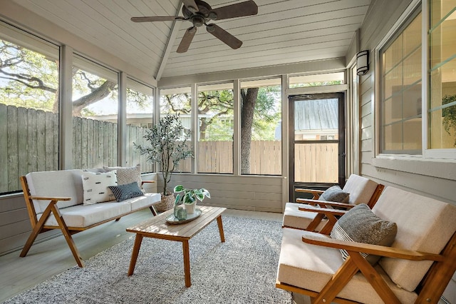 sunroom / solarium featuring an outdoor living space, a ceiling fan, and plenty of natural light