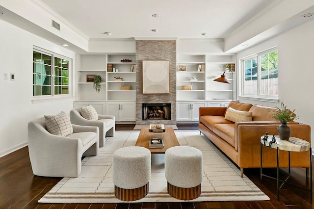 1702 Newning Ave Unit B, Austin, TX 78704 - living area with crown molding, hardwood / wood-style flooring, built in features, baseboards, and a fireplace