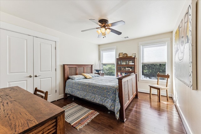 1008 W Monroe St W, Austin, TX 78704 - bedroom with baseboards, dark wood finished floors, a closet, and ceiling fan