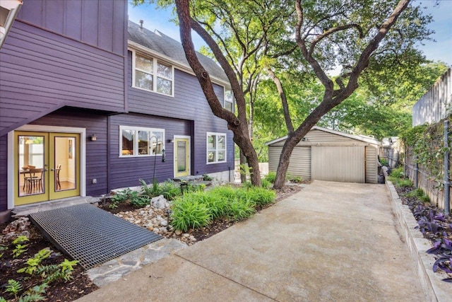 1008 W Monroe St W, Austin, TX 78704 - view of front of home featuring an outbuilding, fence, and board and batten siding