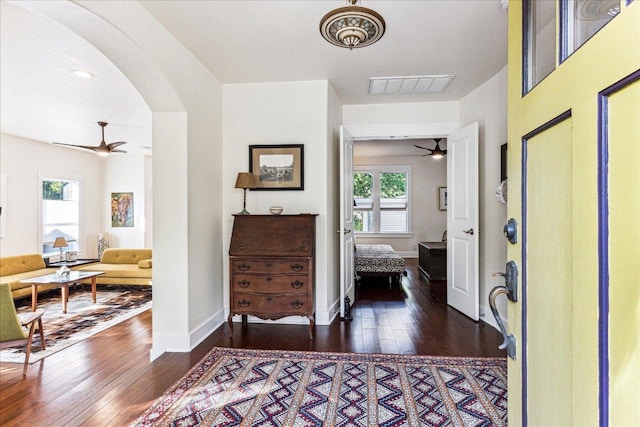 1008 W Monroe St W, Austin, TX 78704 - foyer featuring a ceiling fan, wood-type flooring, arched walkways, and baseboards