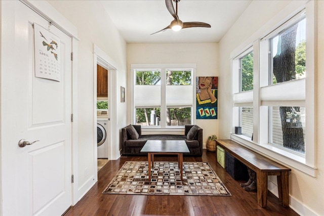 1008 W Monroe St W, Austin, TX 78704 - sitting room featuring wood finished floors, a ceiling fan, baseboards, and washer / clothes dryer